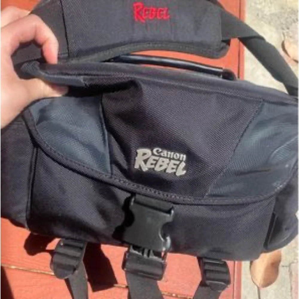 Canon Rebel EOS T3 Camera, Rebel Gadget Bag, Battery Charger, extra 55-25mm lens
